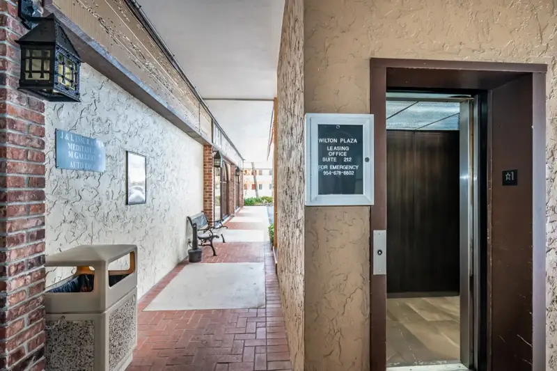 Wilton Plaza lobby with elevator access to Suite 212